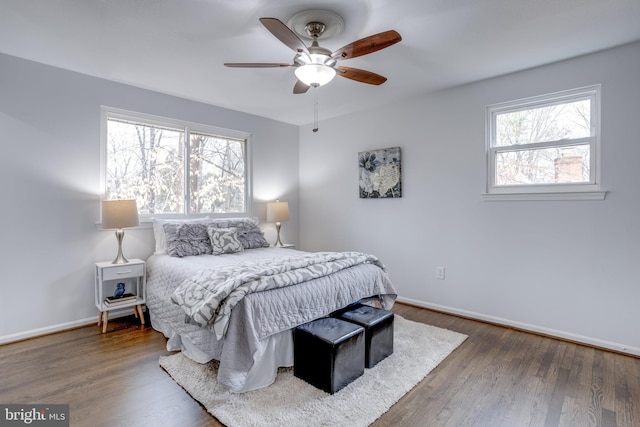 bedroom featuring dark hardwood / wood-style flooring and ceiling fan