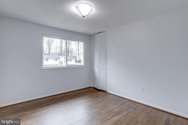 empty room featuring hardwood / wood-style floors