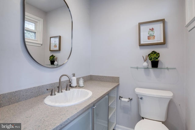 bathroom with vanity and toilet