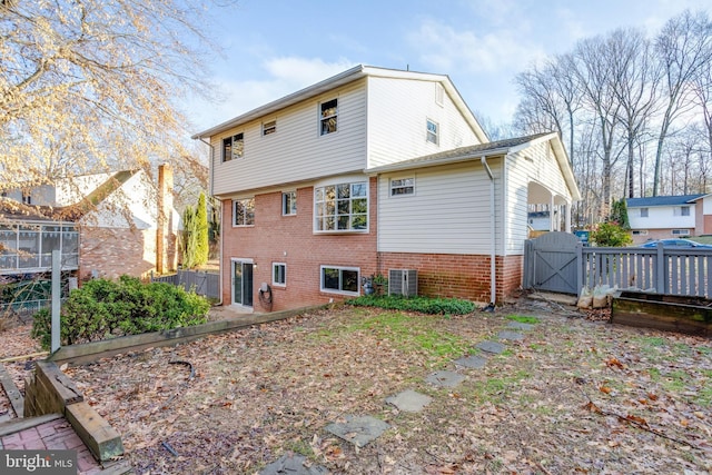 back of house featuring central AC unit