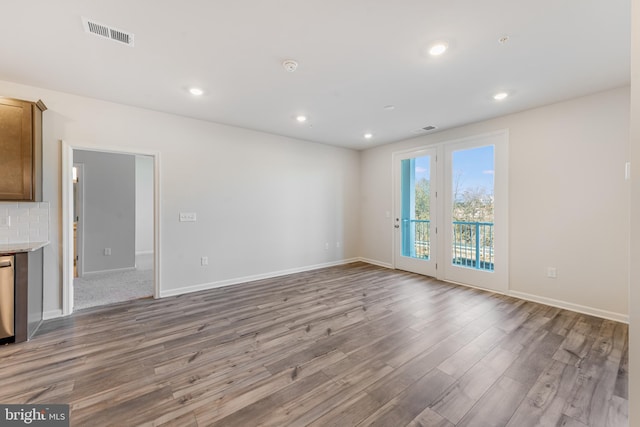 unfurnished living room featuring wood-type flooring