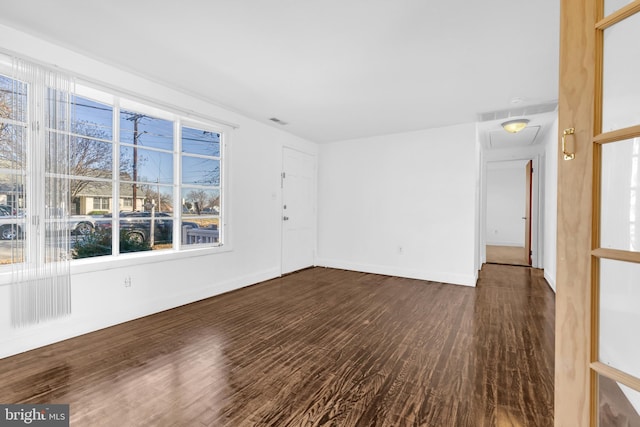 empty room with dark hardwood / wood-style floors