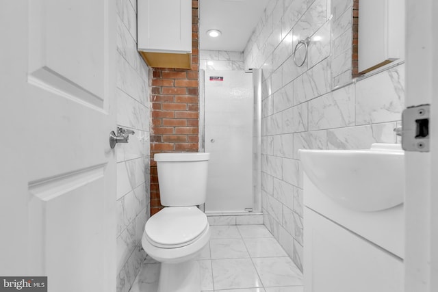 bathroom with an enclosed shower, vanity, toilet, and tile walls