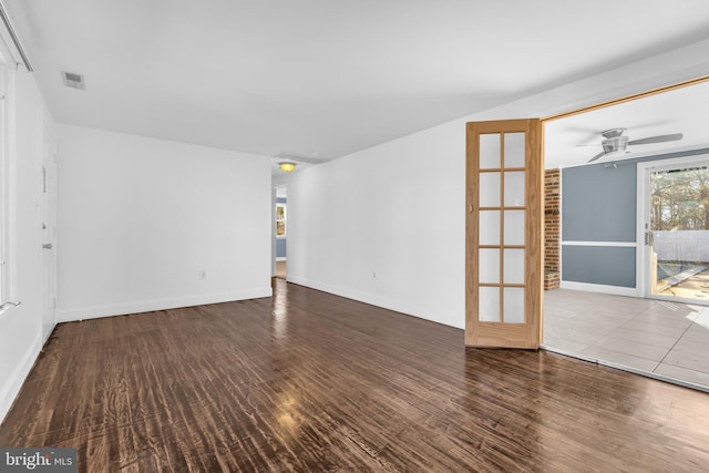 spare room with wood-type flooring, french doors, and ceiling fan