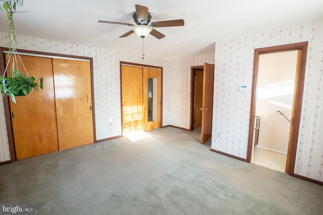 unfurnished bedroom with connected bathroom, ceiling fan, and light colored carpet