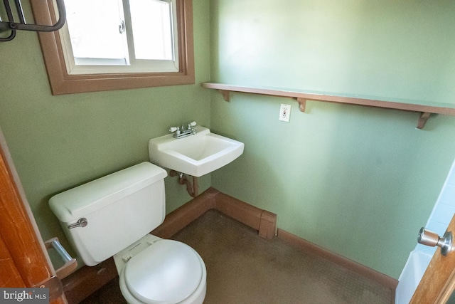 bathroom featuring toilet and sink