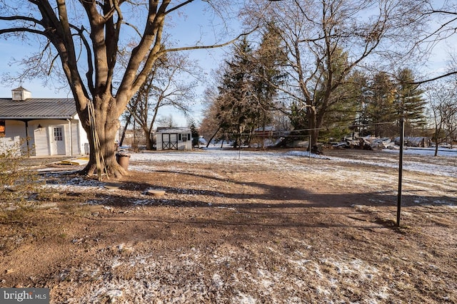 view of yard covered in snow