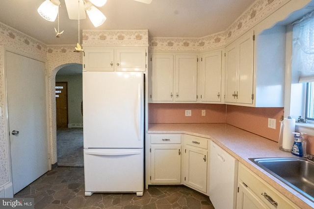 kitchen with ceiling fan, white cabinetry, white appliances, and sink