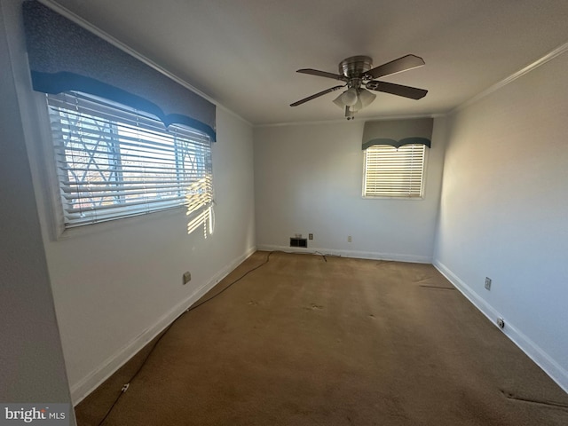 unfurnished room featuring ornamental molding, ceiling fan, and carpet flooring