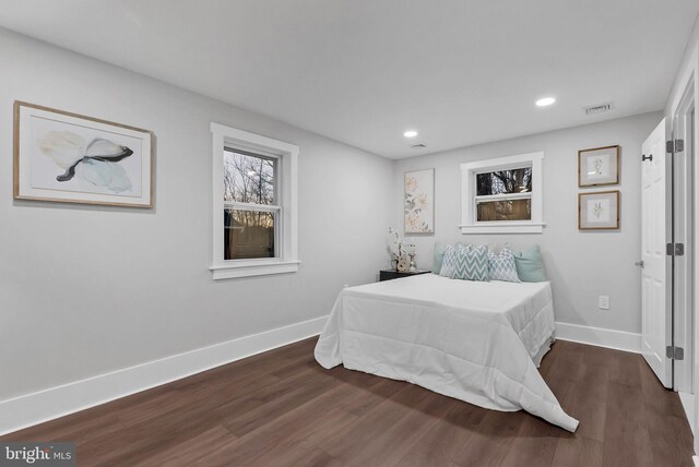 bedroom featuring dark hardwood / wood-style floors