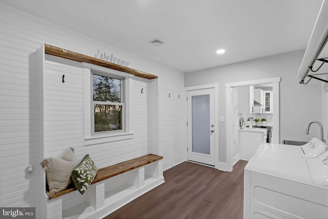 interior space with independent washer and dryer and dark wood-type flooring