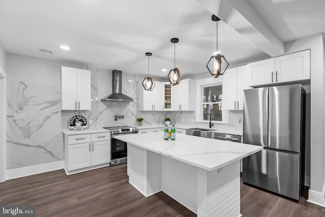 kitchen featuring white cabinetry, sink, wall chimney exhaust hood, and stainless steel appliances