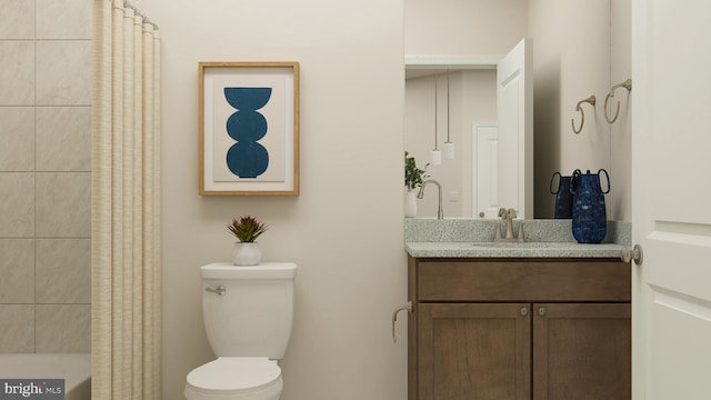 bathroom featuring vanity and toilet