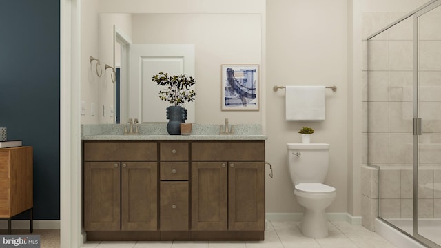 bathroom with tile patterned floors, vanity, toilet, and a shower with shower door