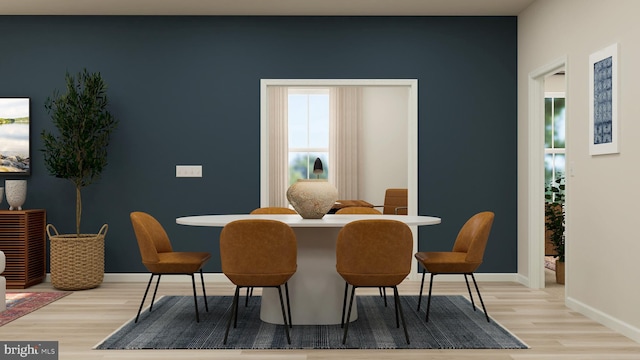 dining space featuring light wood-type flooring