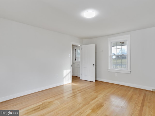 spare room with light hardwood / wood-style floors