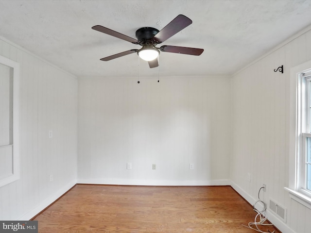 unfurnished room with ceiling fan and light hardwood / wood-style flooring