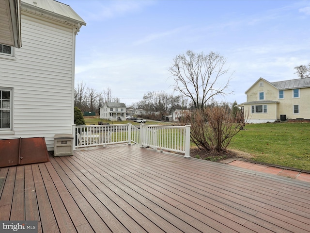 wooden deck featuring a yard