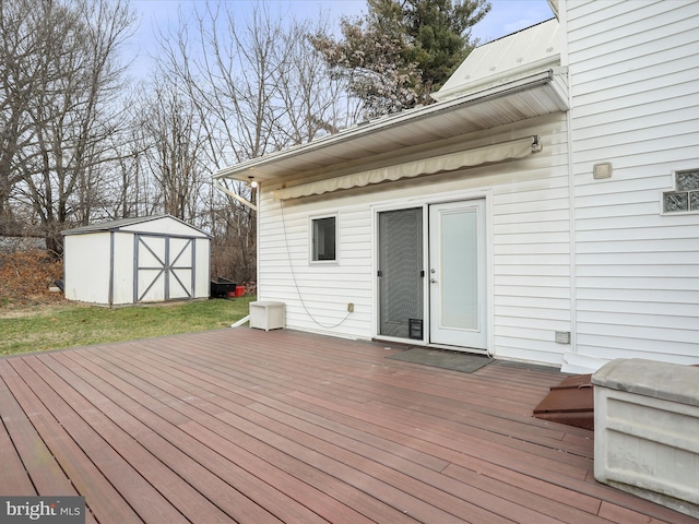 wooden deck featuring a shed