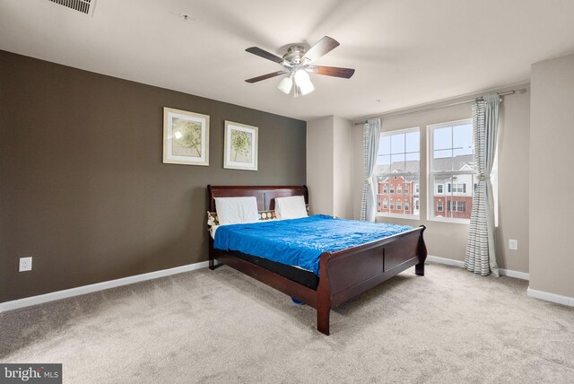 bedroom featuring ceiling fan and light colored carpet