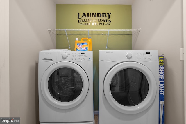 laundry room featuring washer and clothes dryer