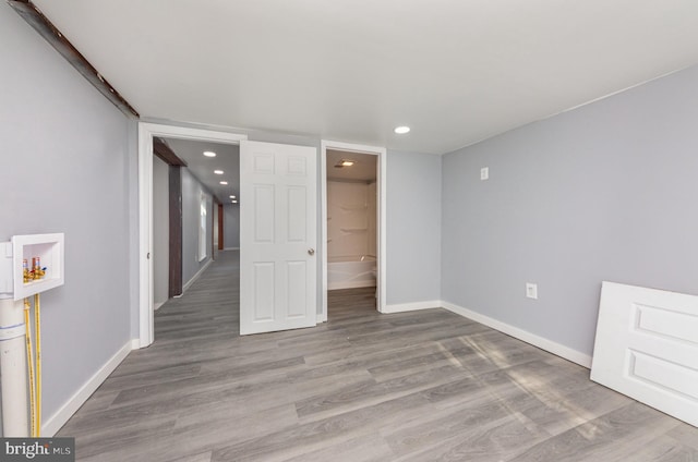 spare room with light wood-type flooring