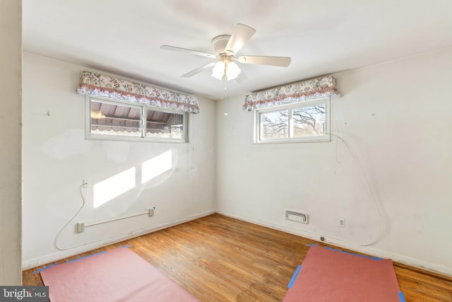 unfurnished room featuring ceiling fan and wood-type flooring