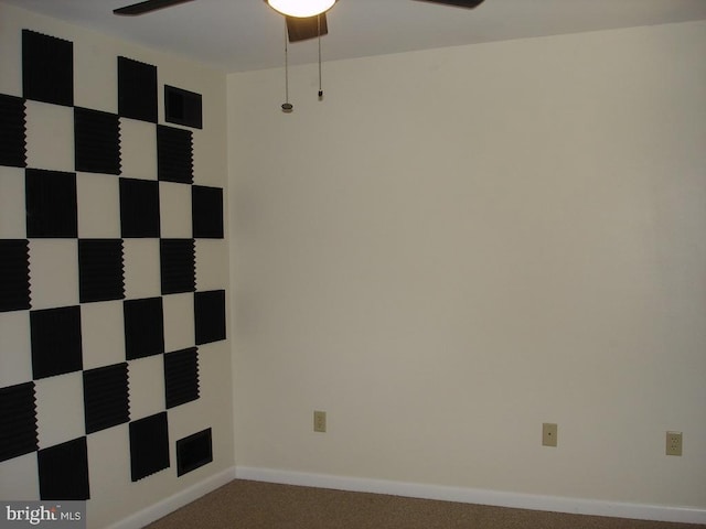 empty room with carpet flooring and ceiling fan