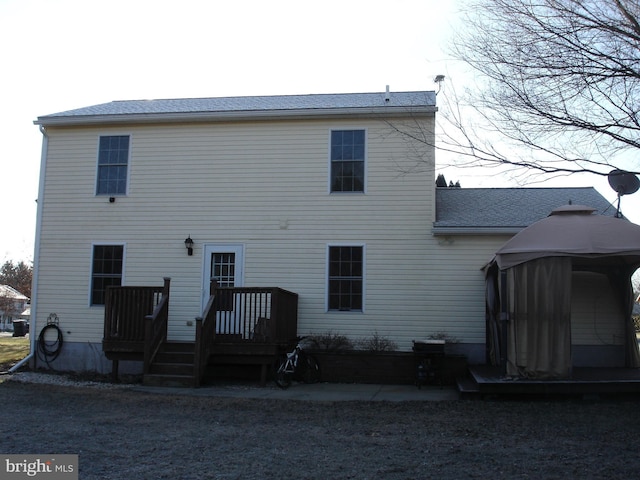 back of house with a gazebo