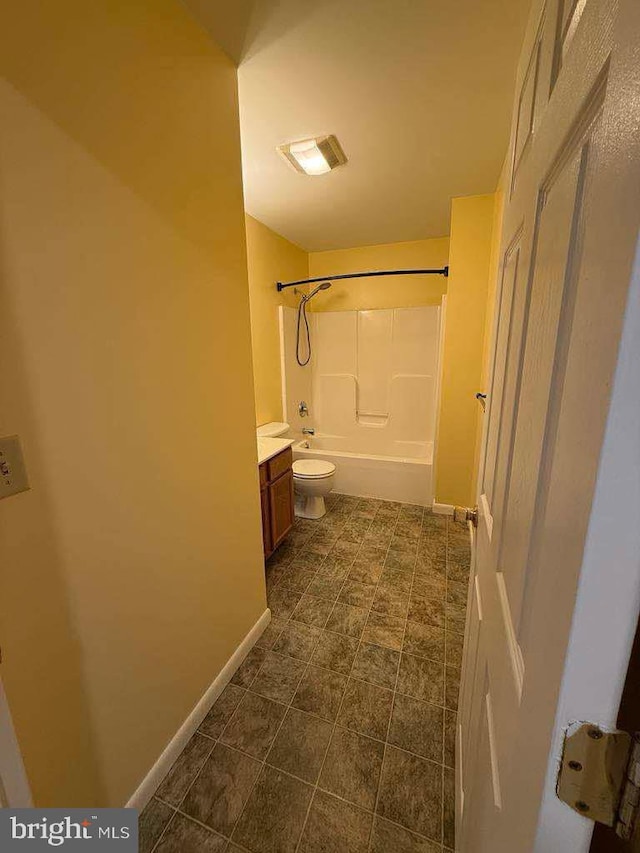 full bathroom featuring washtub / shower combination, vanity, and toilet