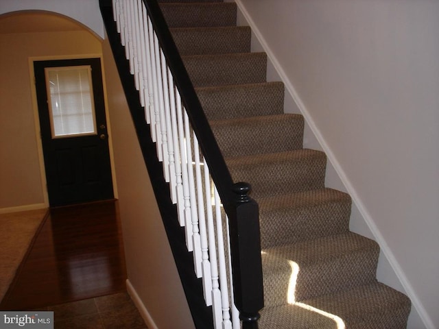 stairway featuring tile patterned floors