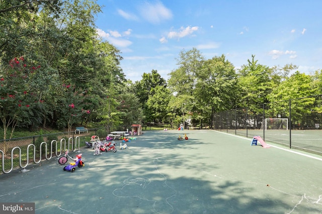 view of sport court with fence