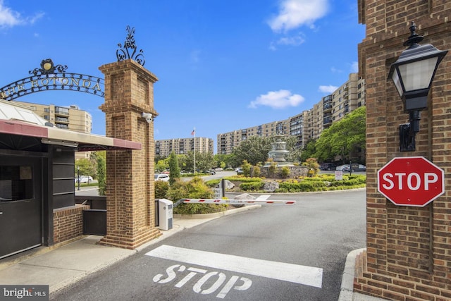 view of street with curbs and a city view