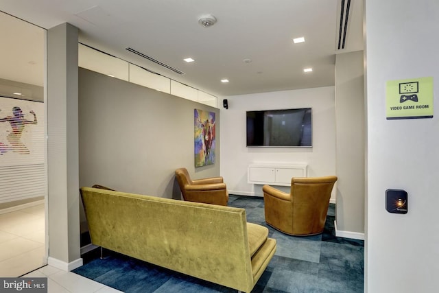 interior space featuring dark tile patterned flooring, baseboards, and visible vents