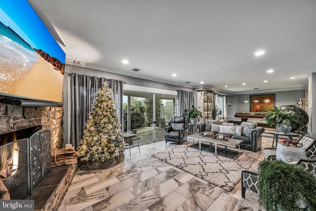 living room featuring a stone fireplace and ornamental molding