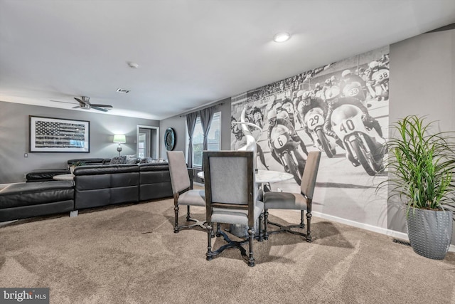 dining space featuring ceiling fan and carpet floors