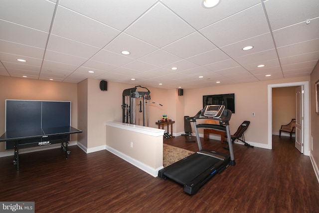 exercise room with dark wood-type flooring