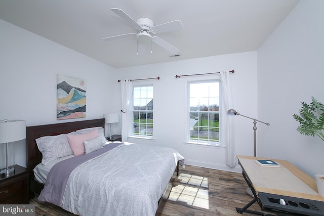 bedroom featuring ceiling fan and dark wood-type flooring