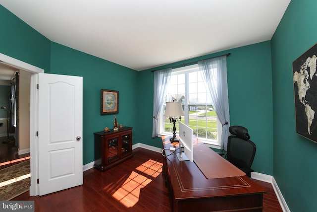 office with dark hardwood / wood-style flooring