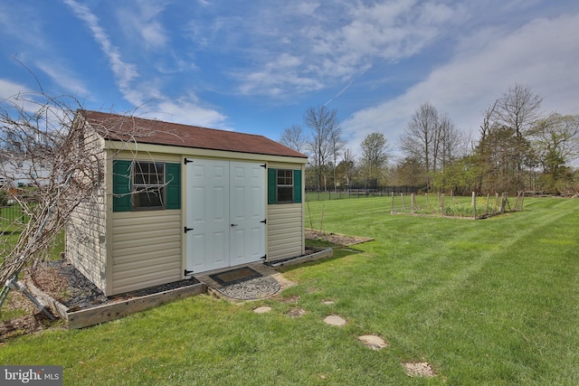 view of outbuilding featuring a yard