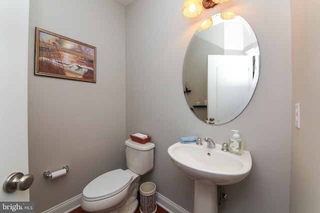 bathroom with sink and toilet