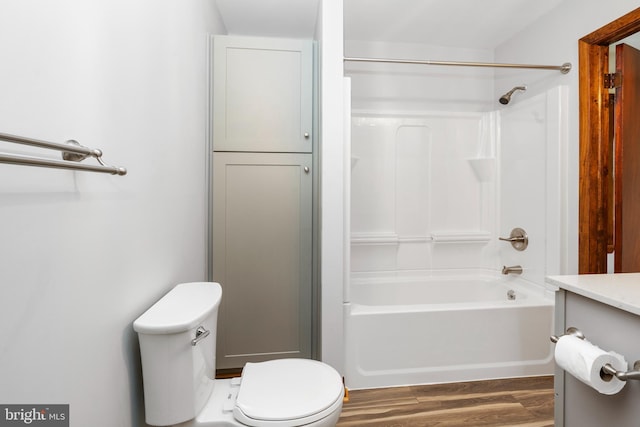 bathroom featuring wood-type flooring and toilet