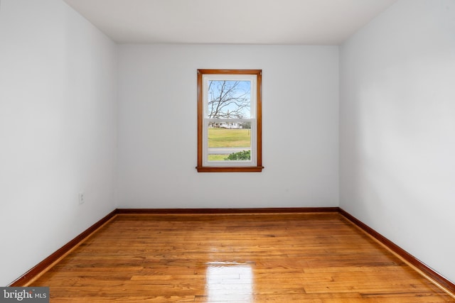 empty room with light hardwood / wood-style floors