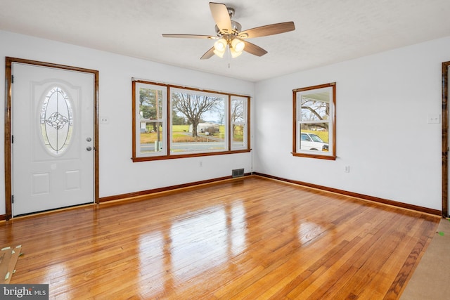 foyer featuring light hardwood / wood-style floors and ceiling fan