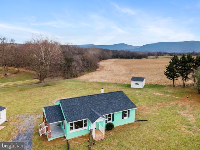 bird's eye view featuring a mountain view and a rural view