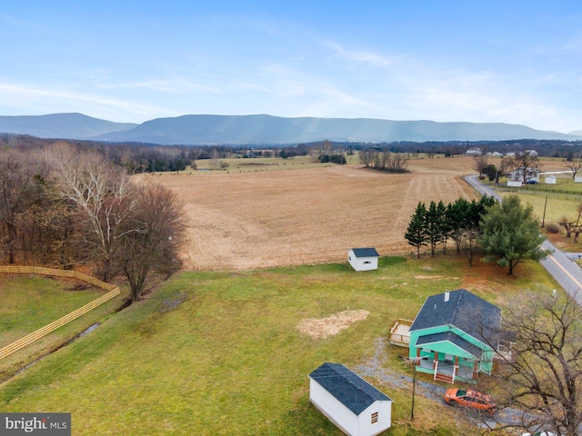 birds eye view of property featuring a mountain view and a rural view