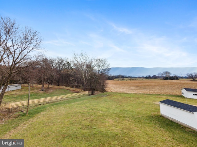 view of yard featuring a mountain view and a rural view