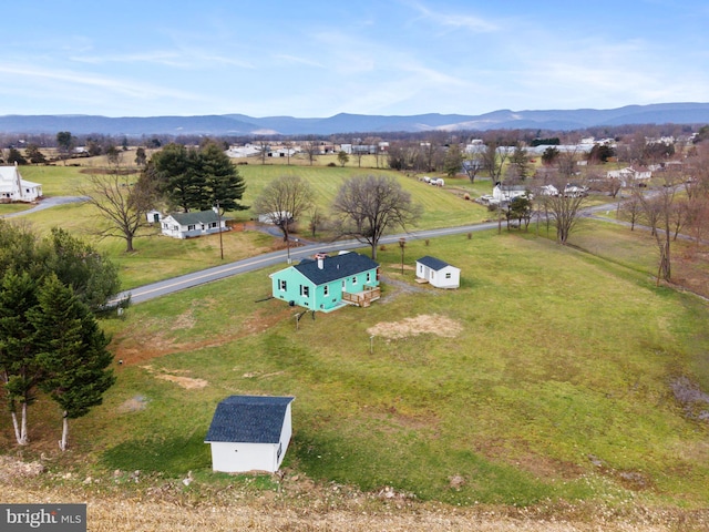 drone / aerial view featuring a mountain view and a rural view