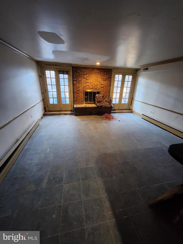 unfurnished living room featuring a brick fireplace, a baseboard radiator, crown molding, and french doors