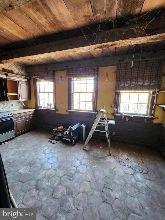 interior space with beamed ceiling and wooden ceiling